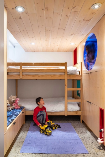 A Kid's Bedroom With Built-In Reading Nooks