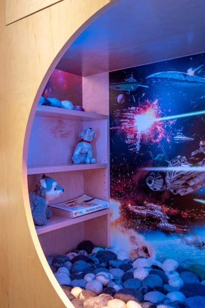 A Kid's Bedroom With Built-In Reading Nooks