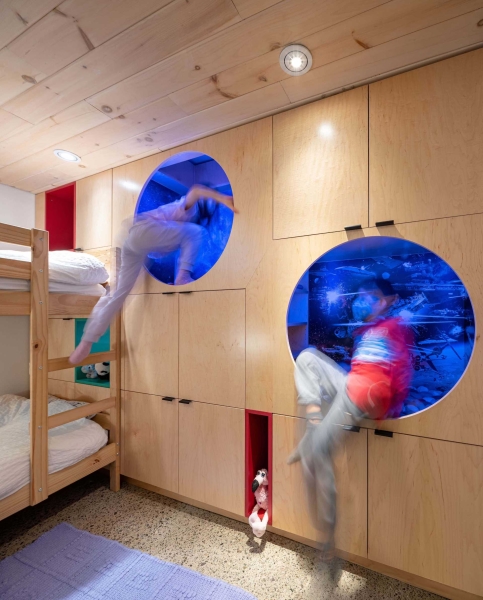 A Kid's Bedroom With Built-In Reading Nooks