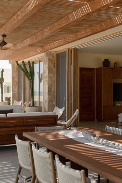 A Stone Covered Home That Surrounds A Central Courtyard With Sunken Seating