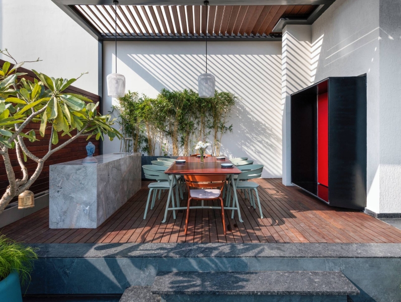 An Orange Spiral Staircase Is An Eye-Catching Feature Inside This Apartment