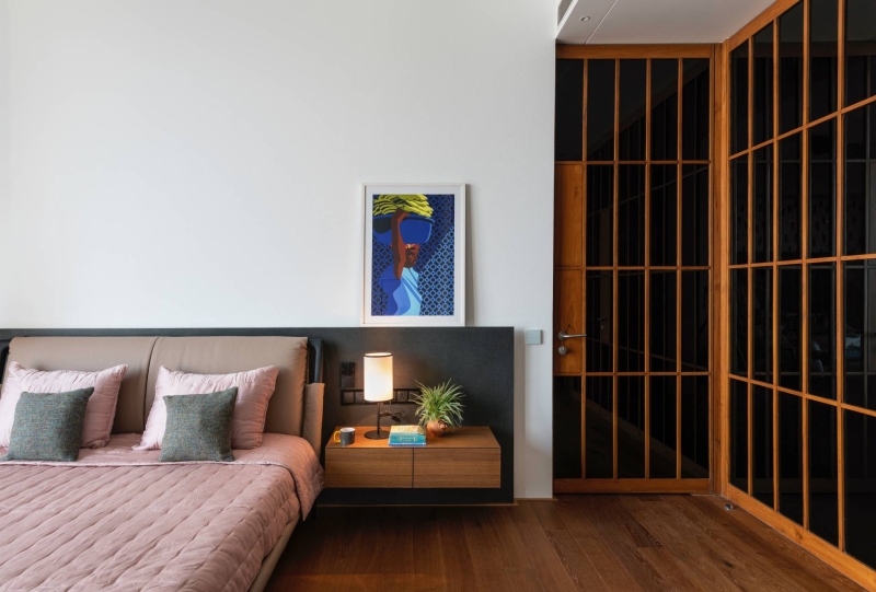 An Orange Spiral Staircase Is An Eye-Catching Feature Inside This Apartment