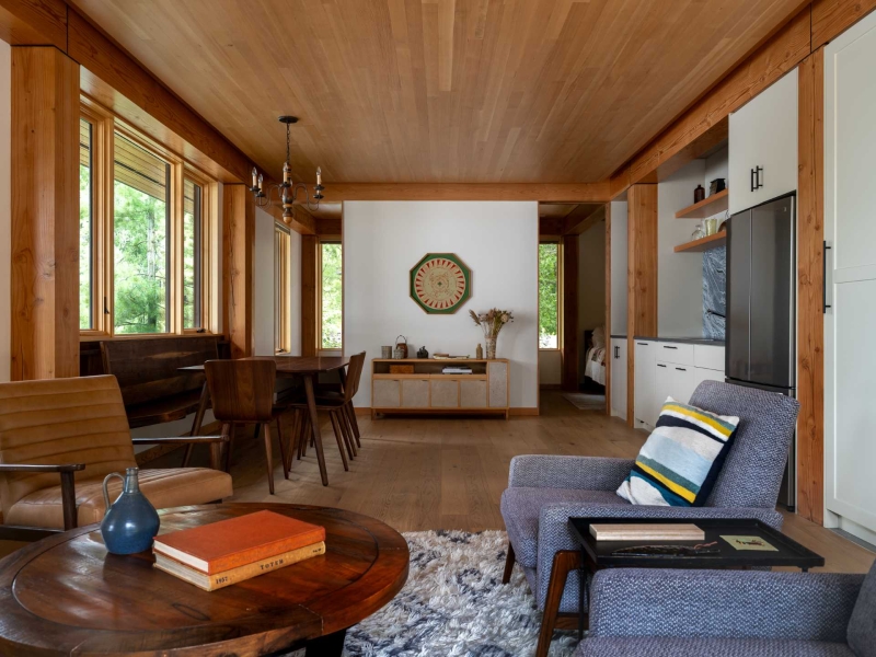 Exposed Wood Posts & Beams Add A Warm Rustic Touch To This Small Cabin