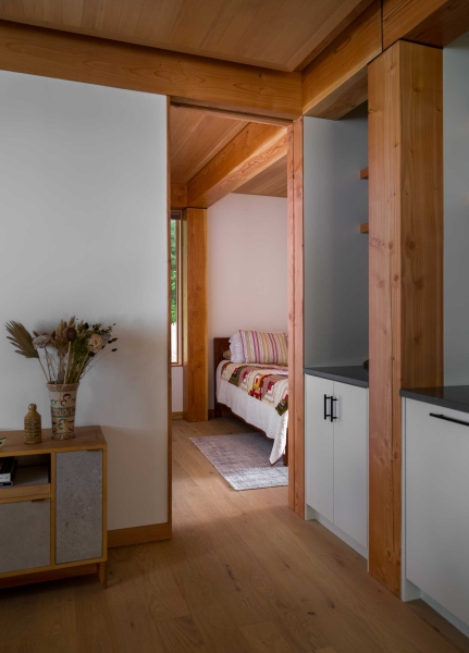 Exposed Wood Posts & Beams Add A Warm Rustic Touch To This Small Cabin