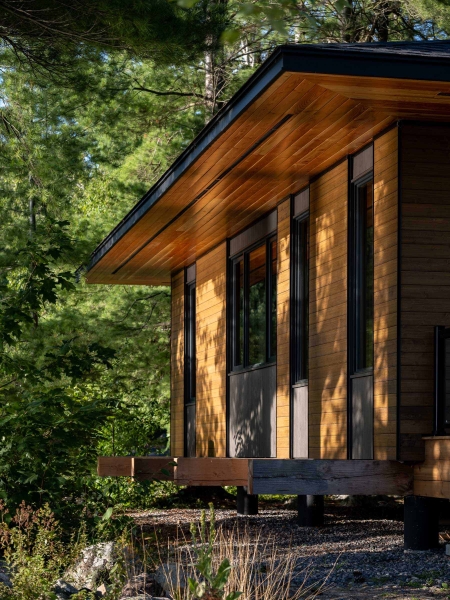 Exposed Wood Posts & Beams Add A Warm Rustic Touch To This Small Cabin