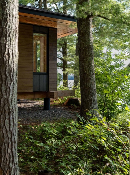 Exposed Wood Posts & Beams Add A Warm Rustic Touch To This Small Cabin