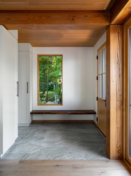 Exposed Wood Posts & Beams Add A Warm Rustic Touch To This Small Cabin