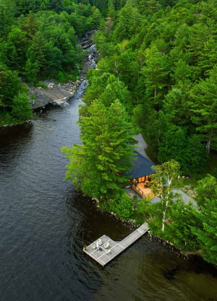 Exposed Wood Posts & Beams Add A Warm Rustic Touch To This Small Cabin