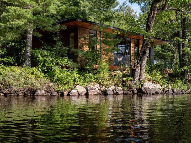 Exposed Wood Posts & Beams Add A Warm Rustic Touch To This Small Cabin