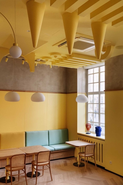 A Yellow Interior Sets The Tone For This Cafe