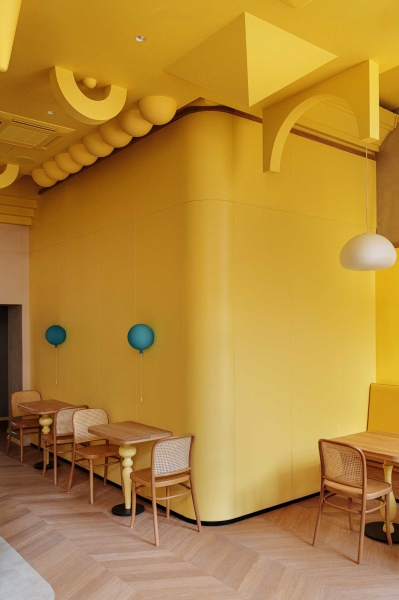 A Yellow Interior Sets The Tone For This Cafe