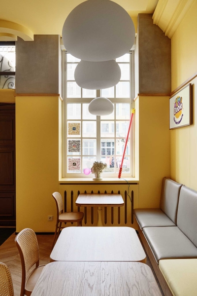 A Yellow Interior Sets The Tone For This Cafe