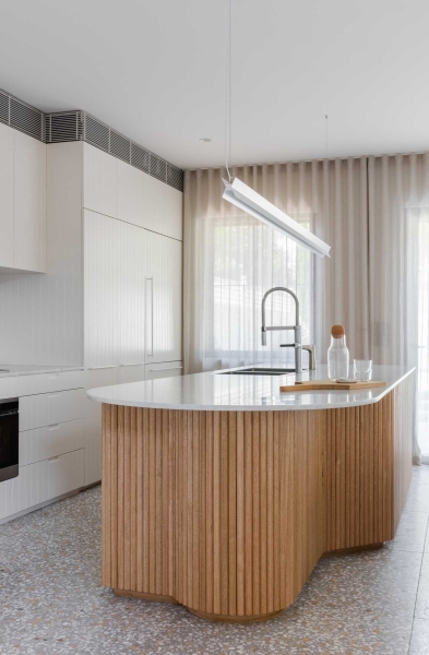 Vertical Panelled Cabinets Add Visual Interest To This Home's Interior