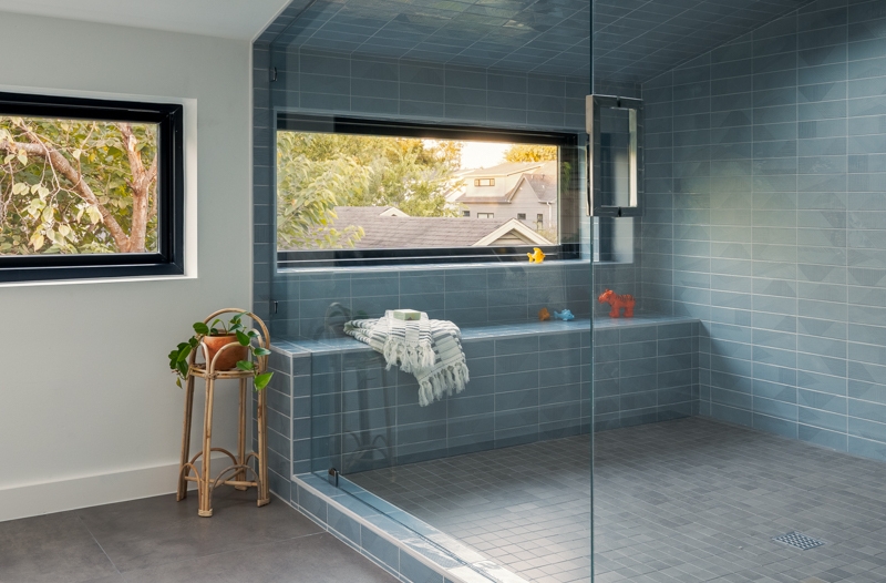 A Sky-Lit Blue-Tiled Shower Steals The Show Inside This Home