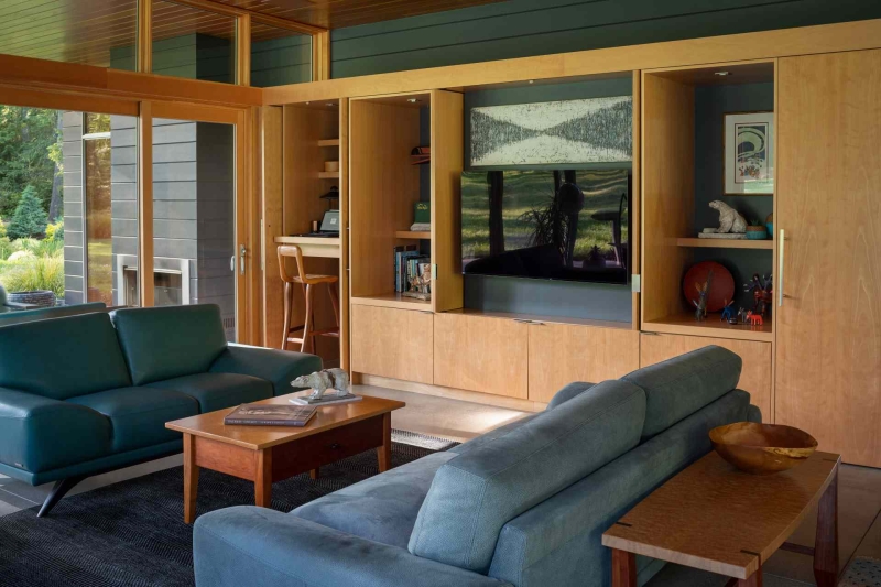 Modern meets nature in this home that opens to a meadow in the trees