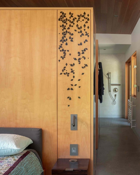 Modern meets nature in this home that opens to a meadow in the trees