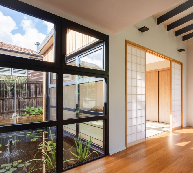 Step inside this Japanese-inspired home extension that's wrapped around a reflection pool