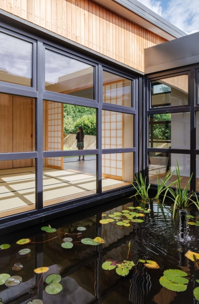 Step inside this Japanese-inspired home extension that's wrapped around a reflection pool