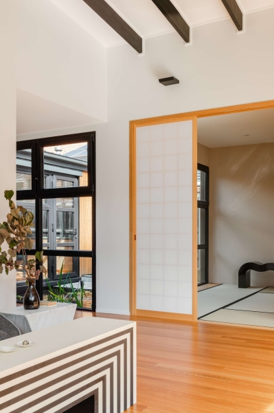 Step inside this Japanese-inspired home extension that's wrapped around a reflection pool