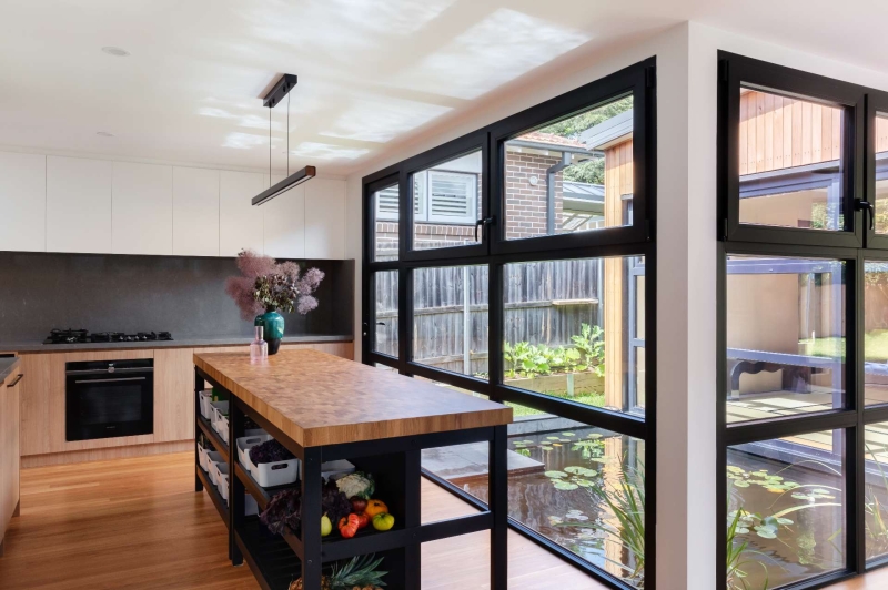 Step inside this Japanese-inspired home extension that's wrapped around a reflection pool