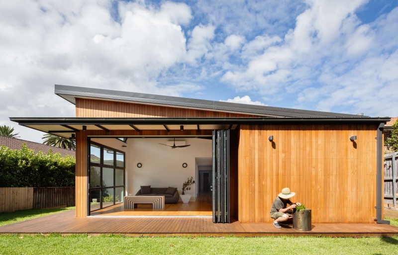 Step inside this Japanese-inspired home extension that's wrapped around a reflection pool