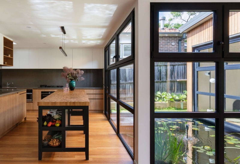 Step inside this Japanese-inspired home extension that's wrapped around a reflection pool