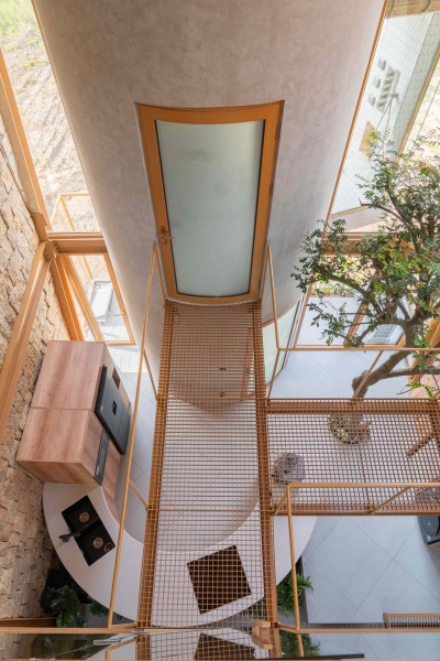 This house collects rainwater, grows trees indoors, and runs on solar power