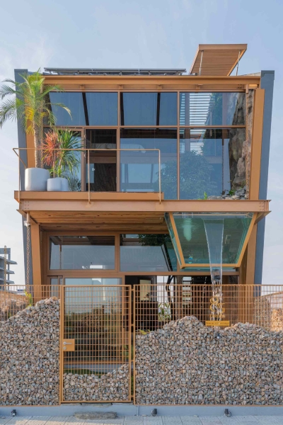 This house collects rainwater, grows trees indoors, and runs on solar power