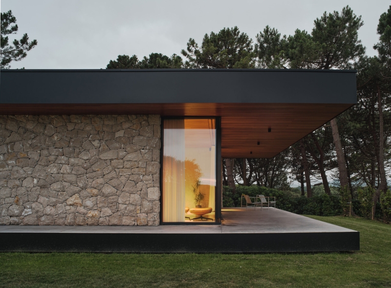 A Seaside Home Where Limestone, Wood, and Glass Unite