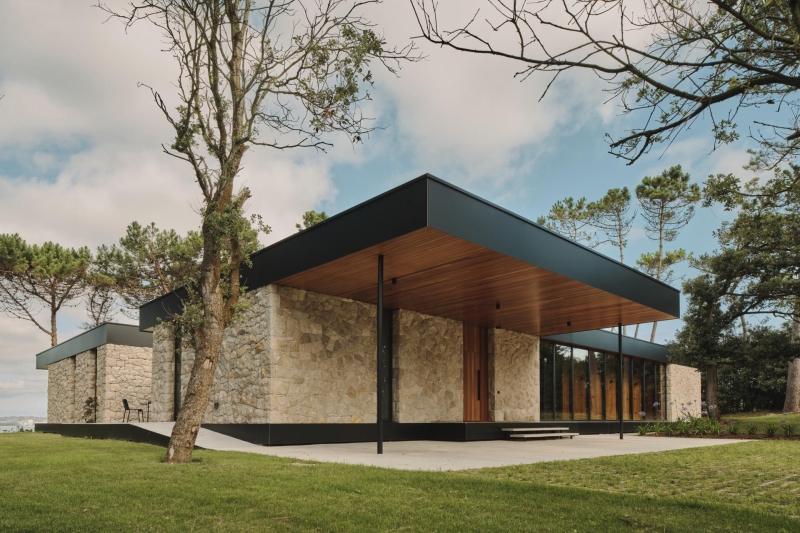 A Seaside Home Where Limestone, Wood, and Glass Unite