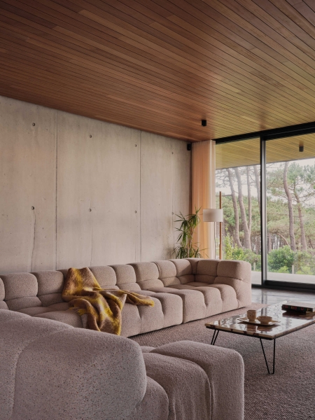 A Seaside Home Where Limestone, Wood, and Glass Unite