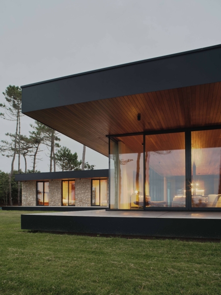 A Seaside Home Where Limestone, Wood, and Glass Unite