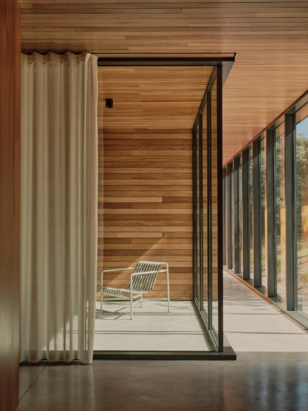 A Seaside Home Where Limestone, Wood, and Glass Unite