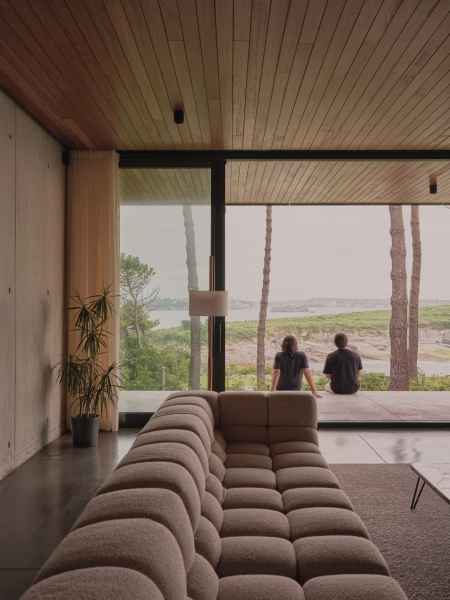 A Seaside Home Where Limestone, Wood, and Glass Unite