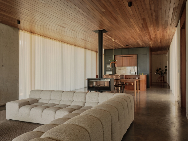 A Seaside Home Where Limestone, Wood, and Glass Unite