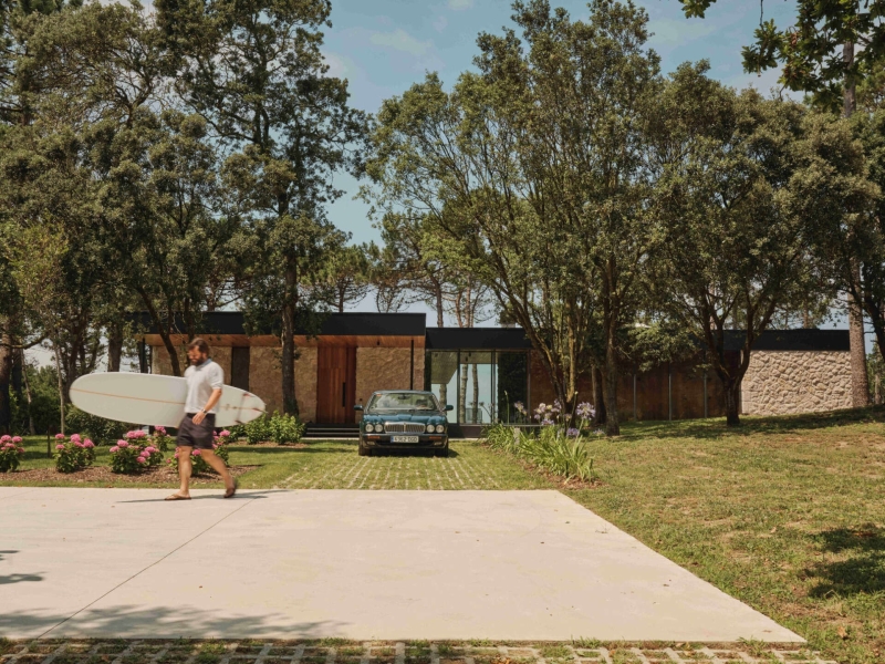 A Seaside Home Where Limestone, Wood, and Glass Unite