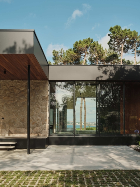 A Seaside Home Where Limestone, Wood, and Glass Unite