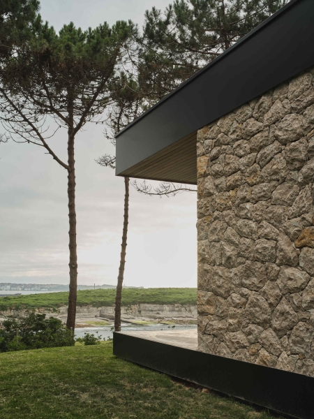 A Seaside Home Where Limestone, Wood, and Glass Unite