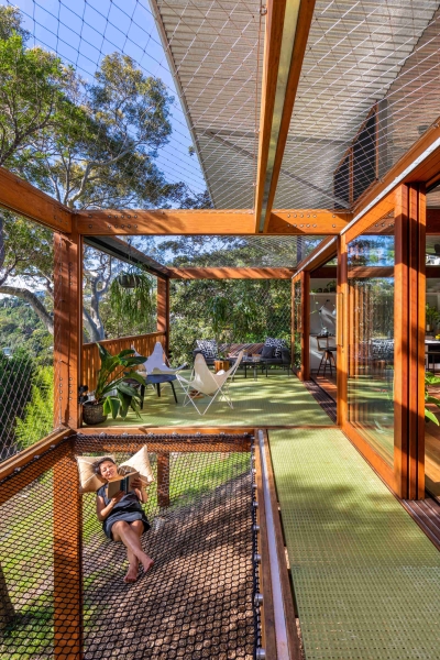 Above the Ground, Among the Leaves: A Modest Prefab Timber Home in the Trees