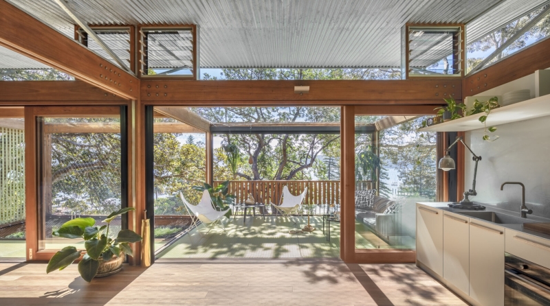 Above the Ground, Among the Leaves: A Modest Prefab Timber Home in the Trees