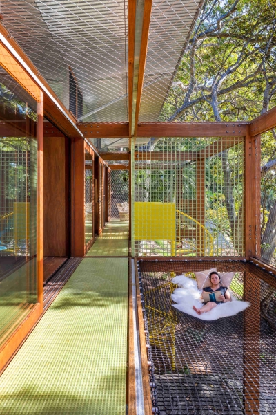 Above the Ground, Among the Leaves: A Modest Prefab Timber Home in the Trees