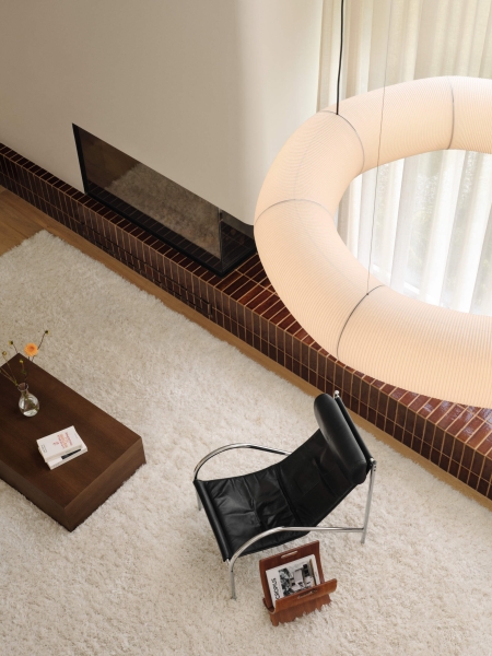 At First It Looks Simple, Then You Notice the Curved Fireplace and Built-In Lounge