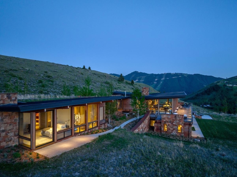 This Grass-Roofed Home With Stone Walls Feels Like It Grew From the Mountain