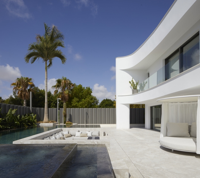 Tucked Behind This Minimalist Home Is a Backyard Oasis