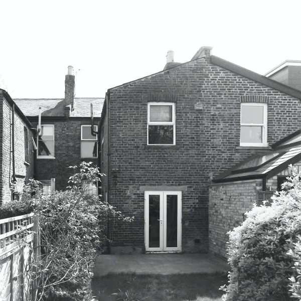 A black wood extension turned this house in London into a light filled garden home