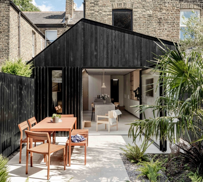 A black wood extension turned this house in London into a light filled garden home