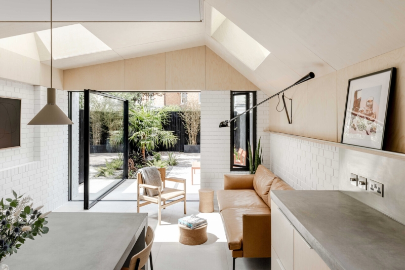 A black wood extension turned this house in London into a light filled garden home