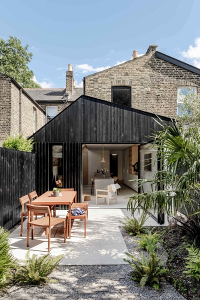 A black wood extension turned this house in London into a light filled garden home