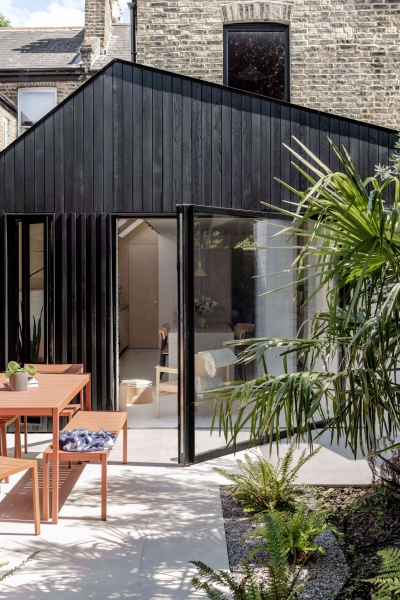 A black wood extension turned this house in London into a light filled garden home