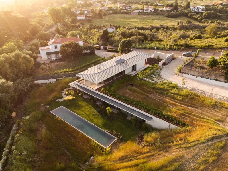 Blending Into Nature: A Half-Buried House With A Green Roof